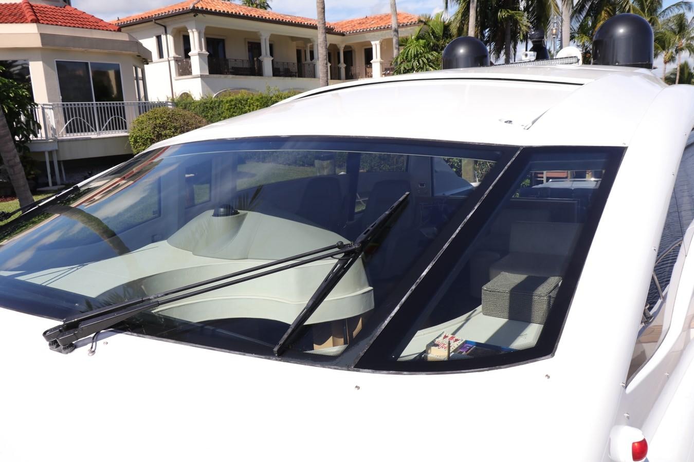 a white car with a black hood aboard VANTAGE Yacht for Sale