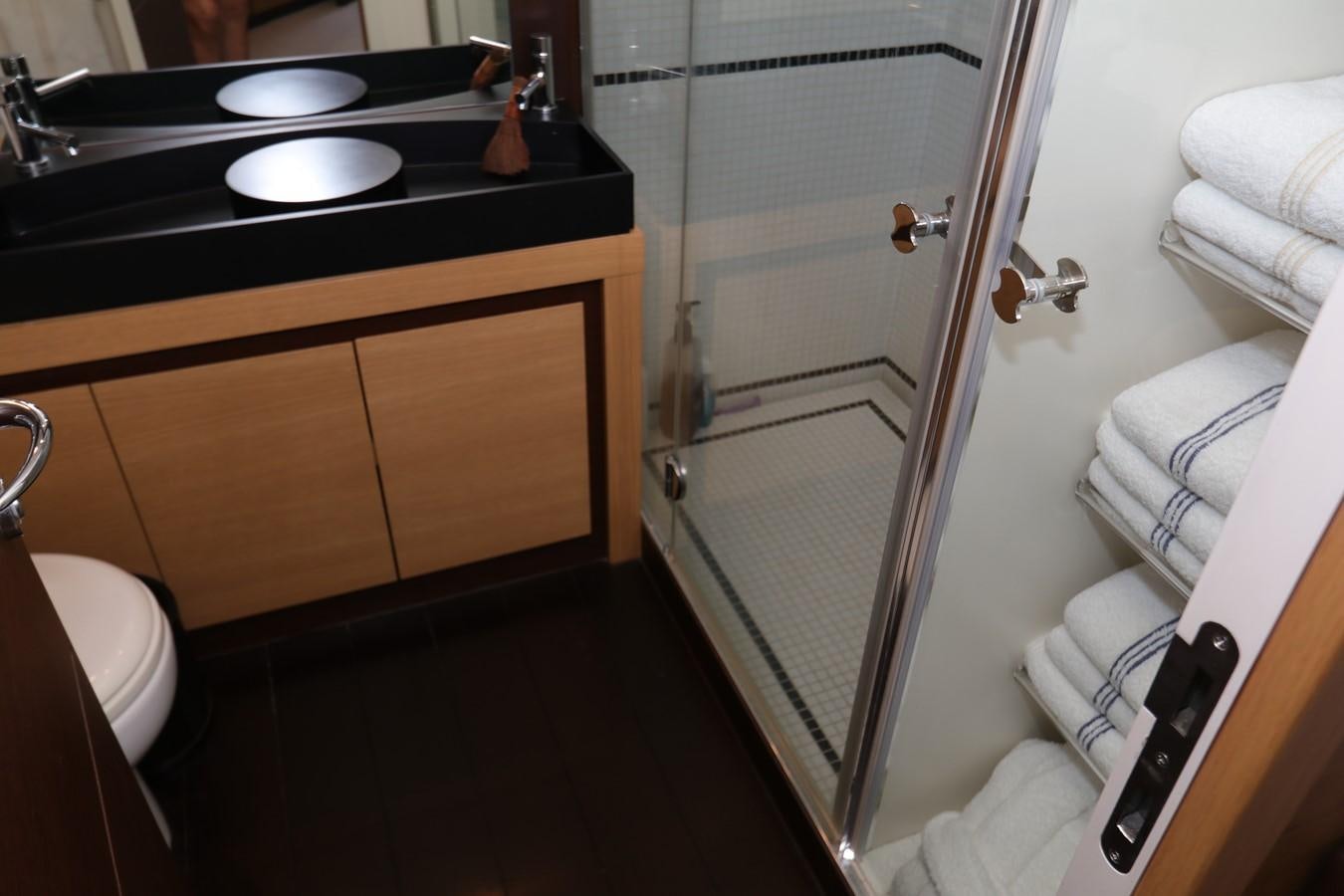 a bathroom with a sink and a shower aboard VANTAGE Yacht for Sale