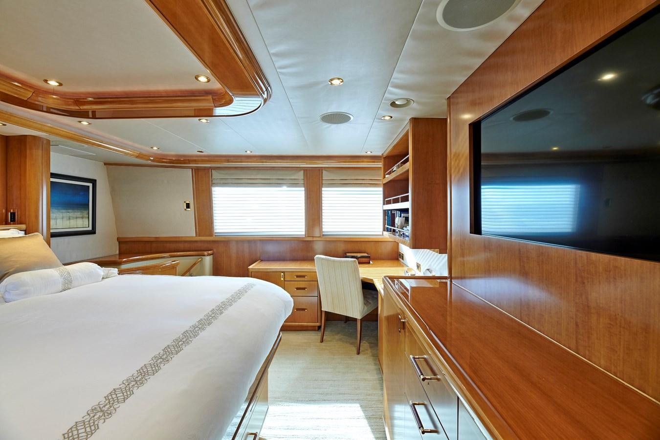 a room with a bed and a table aboard HATATY Yacht for Sale
