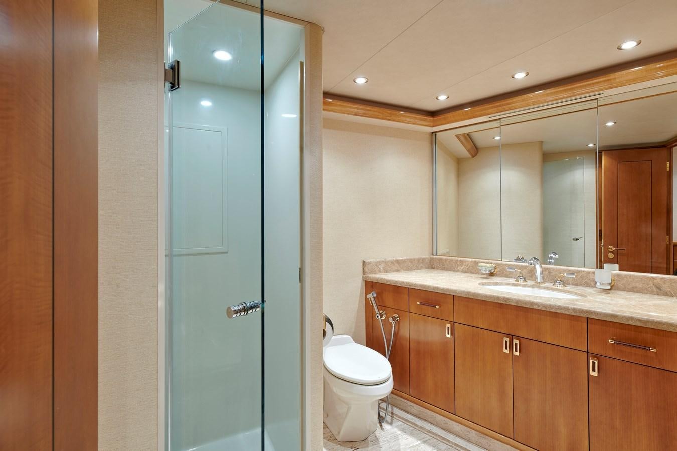a bathroom with a glass shower aboard HATATY Yacht for Sale