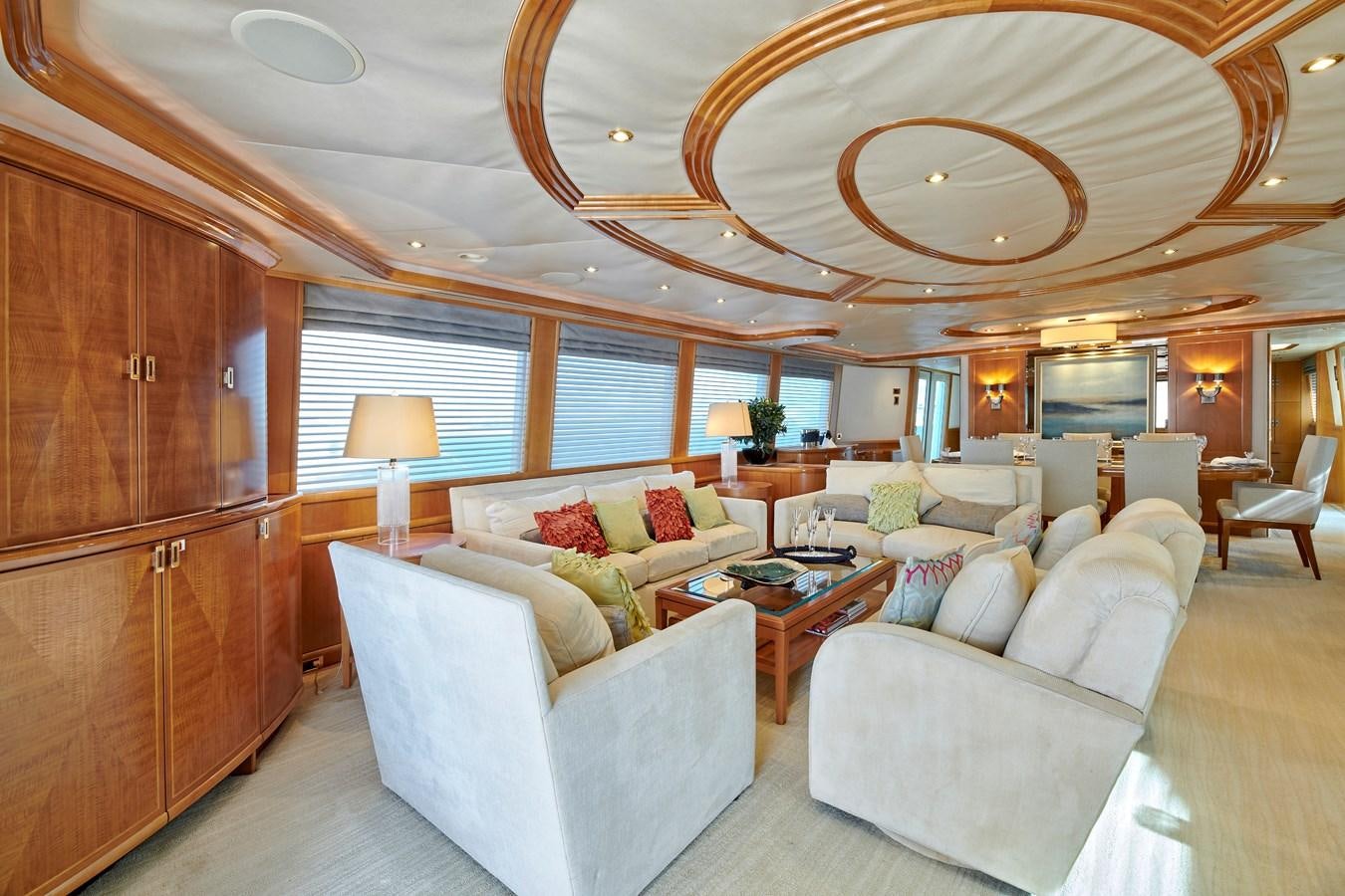 a living room with a large chandelier aboard HATATY Yacht for Sale