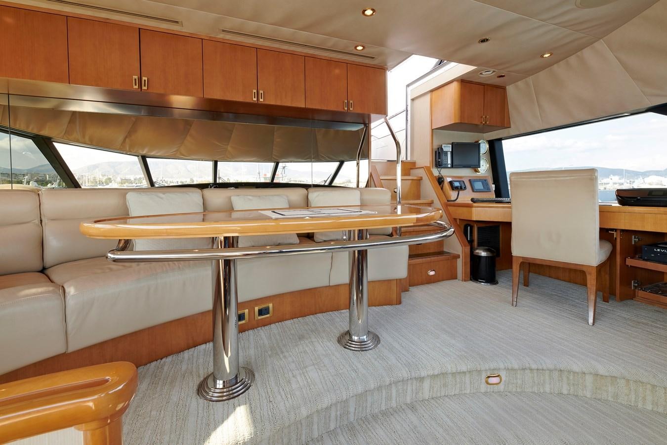a room with a table and chairs aboard HATATY Yacht for Sale