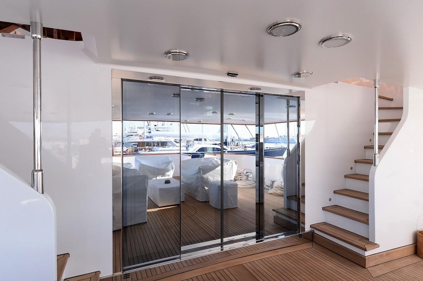 a glass door leading to a room aboard SHAF Yacht for Sale
