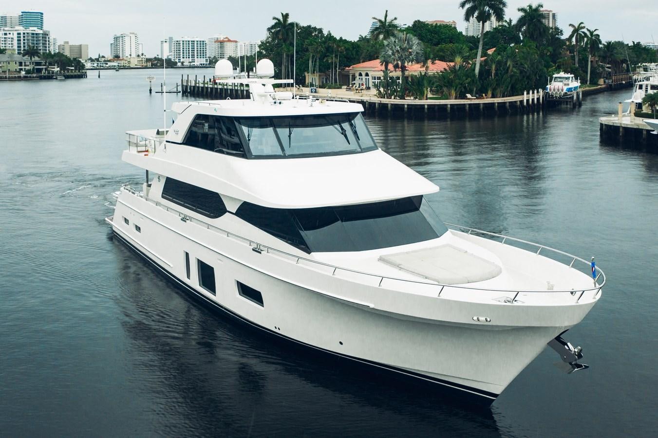 a white yacht in the water aboard 2019 OCEAN ALEXANDER 88 SKYLOUNGE MUDSLINGER Yacht for Sale