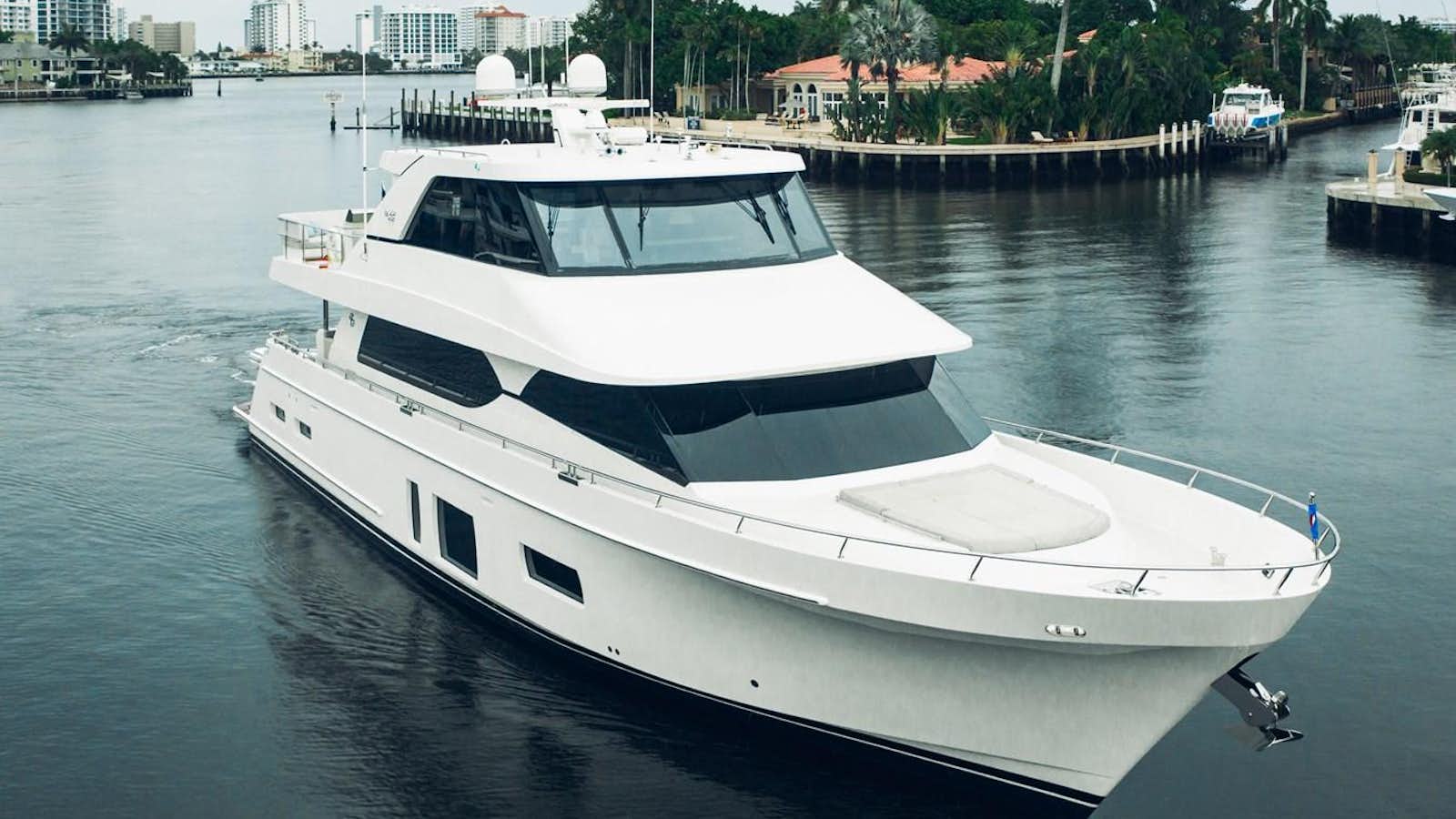 a white yacht in the water aboard 2019 OCEAN ALEXANDER 88 SKYLOUNGE MUDSLINGER Yacht for Sale
