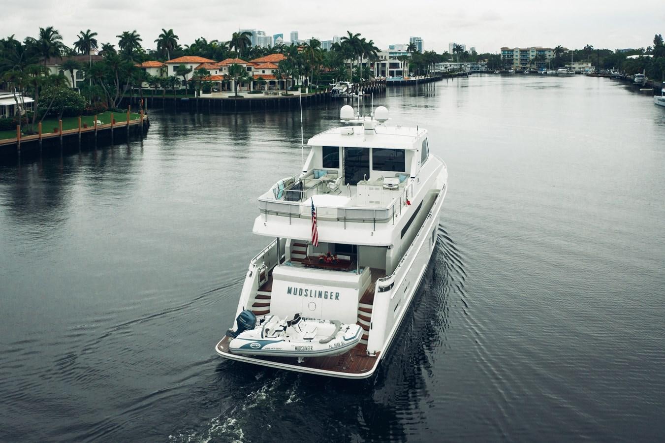 a boat on the water aboard 2019 OCEAN ALEXANDER 88 SKYLOUNGE MUDSLINGER Yacht for Sale