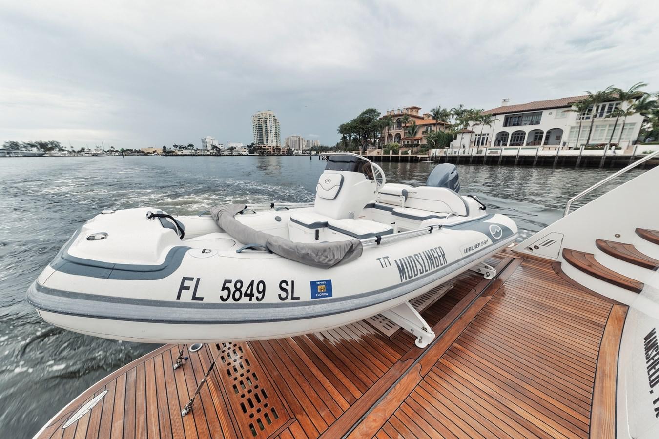 a boat parked on a dock aboard 2019 OCEAN ALEXANDER 88 SKYLOUNGE MUDSLINGER Yacht for Sale