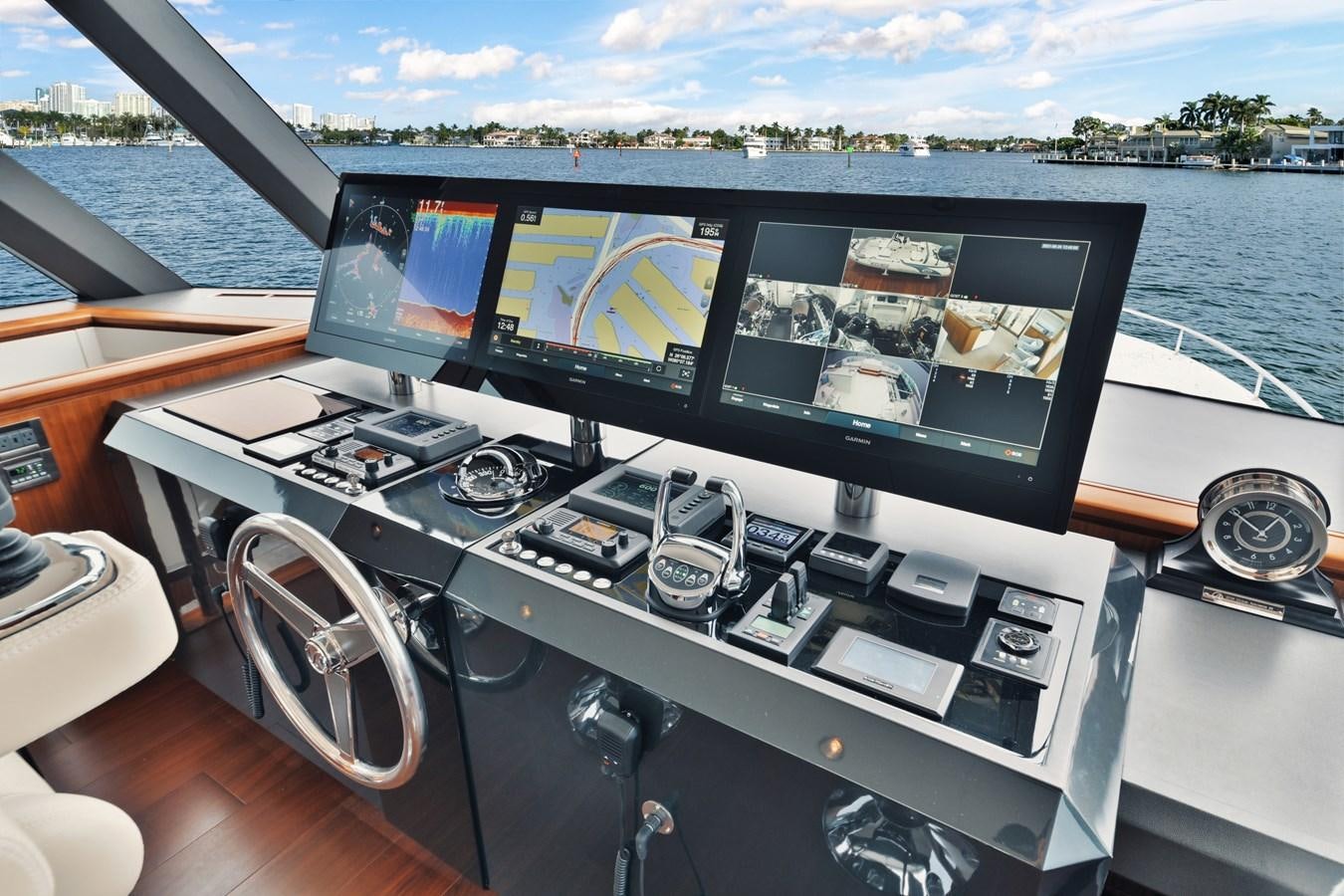 a boat on the water aboard 2019 OCEAN ALEXANDER 88 SKYLOUNGE MUDSLINGER Yacht for Sale