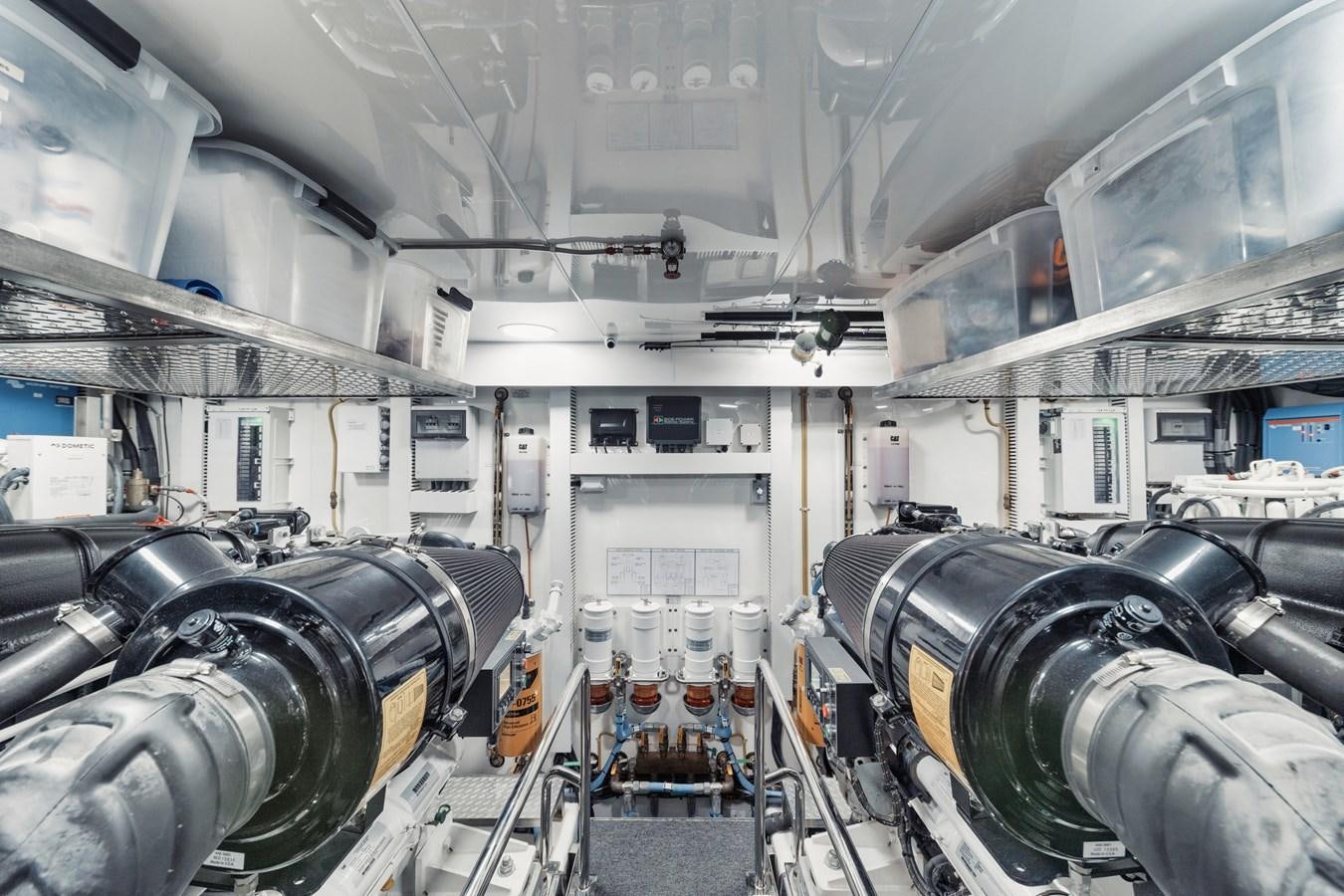 a large machine in a factory aboard 2019 OCEAN ALEXANDER 88 SKYLOUNGE MUDSLINGER Yacht for Sale