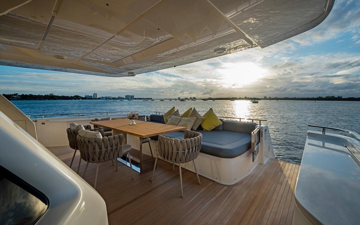 a room with a table and chairs aboard LA MARTINA Yacht for Sale