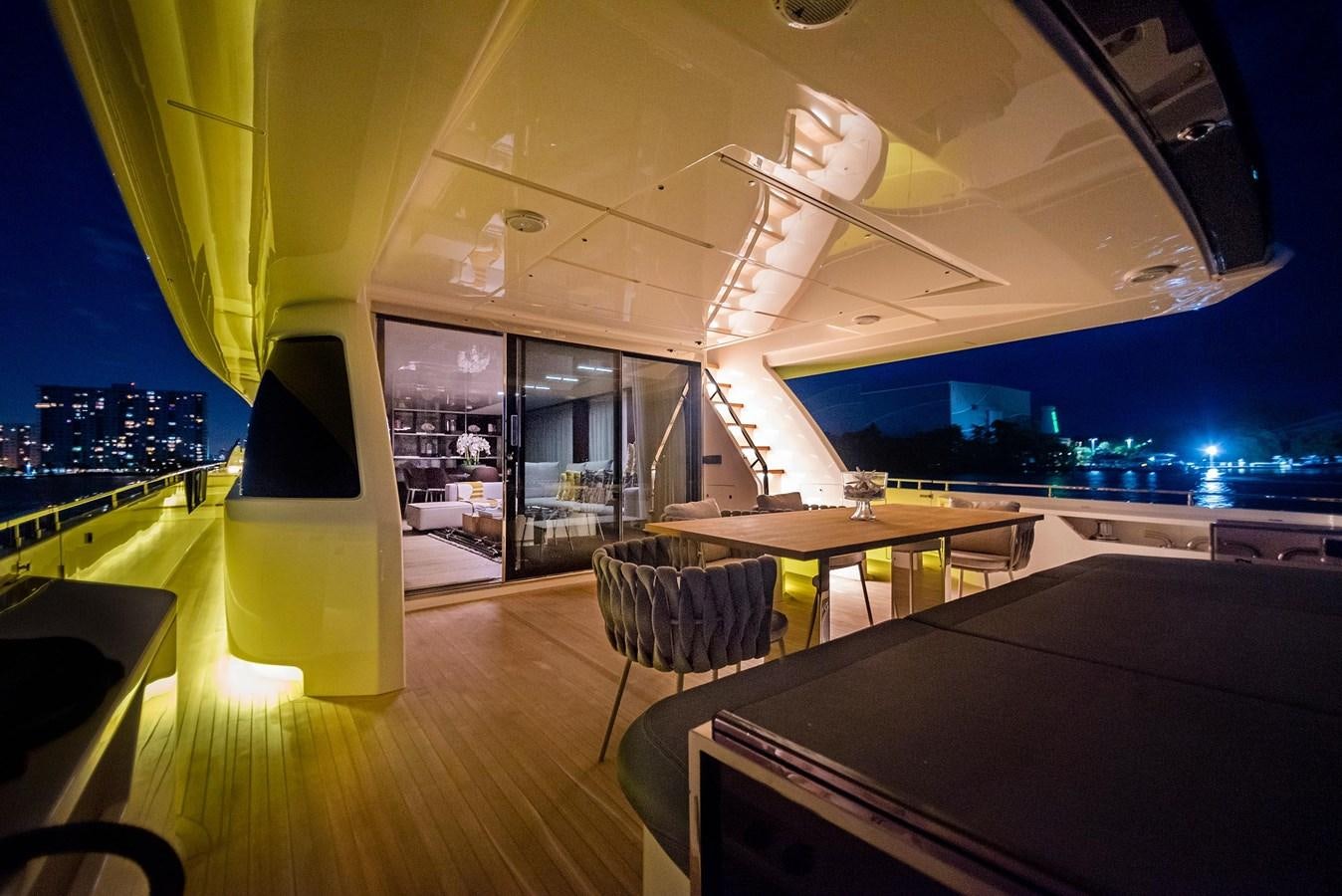 a room with a table and chairs aboard LA MARTINA Yacht for Sale