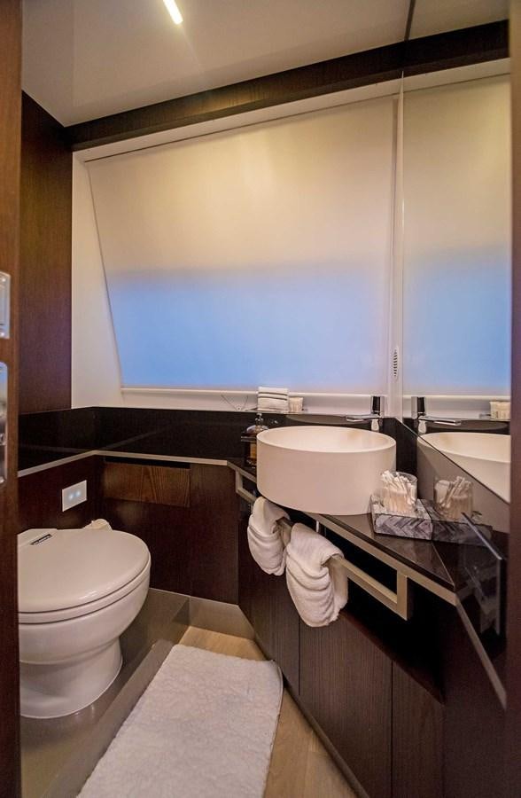 a bathroom with a large window aboard LA MARTINA Yacht for Sale