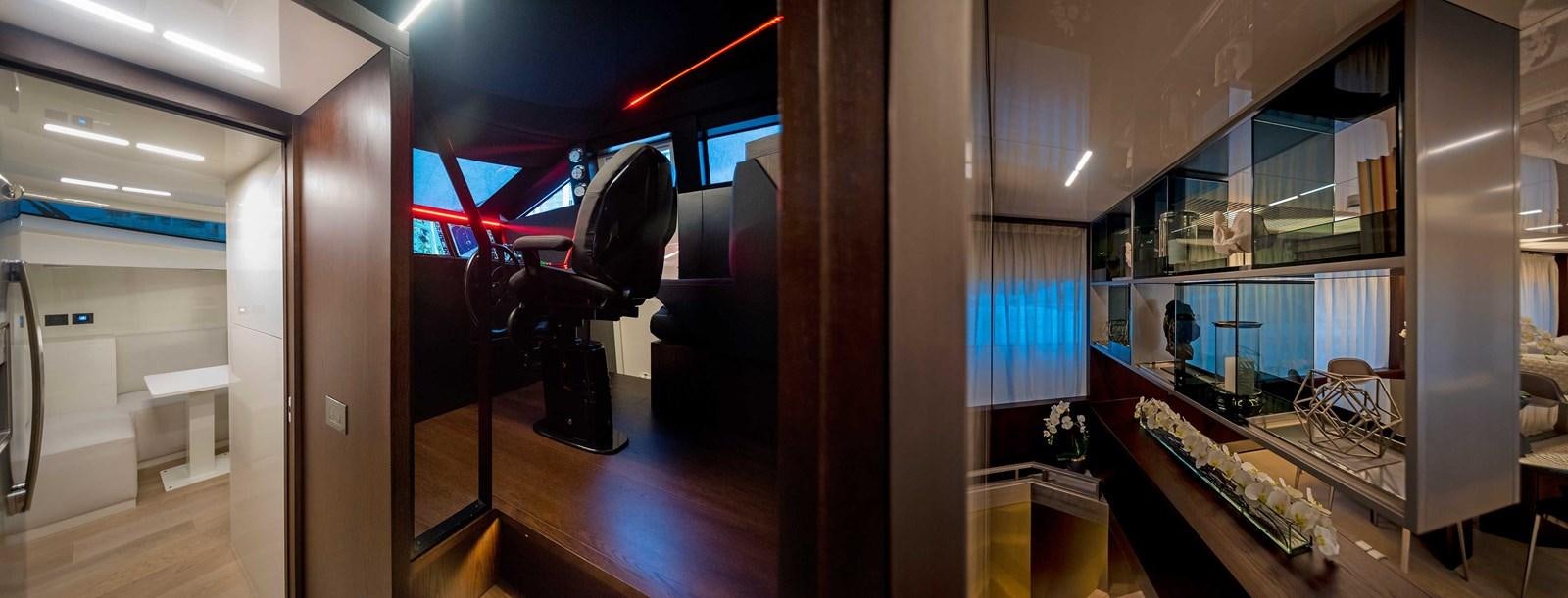 a room with a desk and chairs aboard LA MARTINA Yacht for Sale