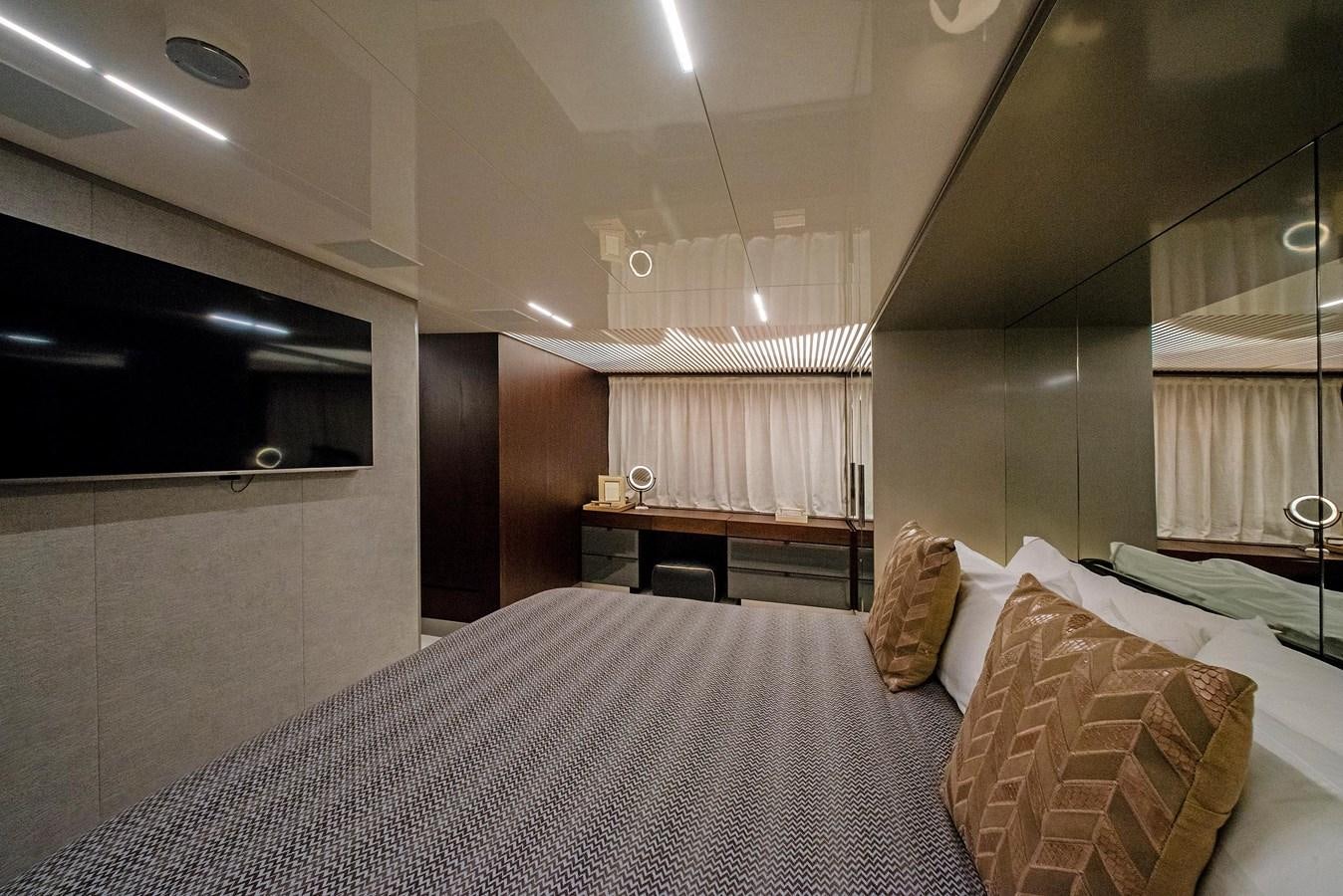 a bed with pillows and a bed aboard LA MARTINA Yacht for Sale