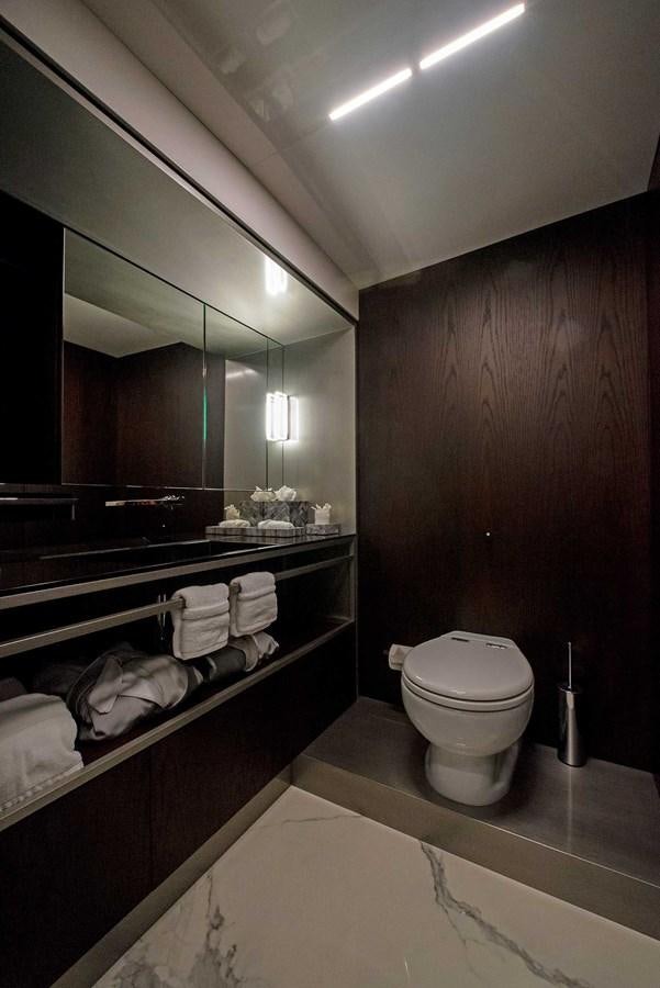 a bathroom with a large mirror aboard LA MARTINA Yacht for Sale
