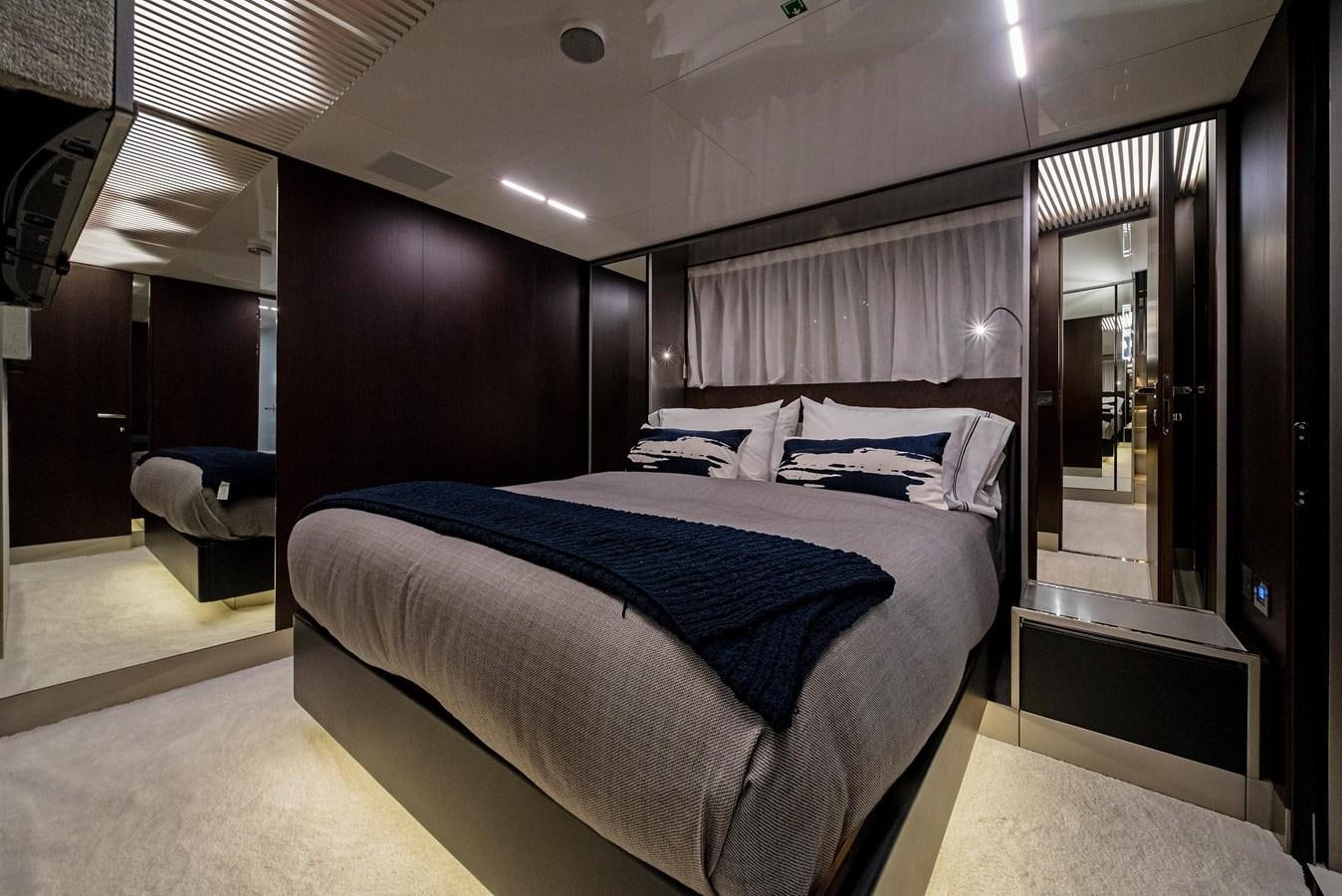 a bed in a room aboard LA MARTINA Yacht for Sale