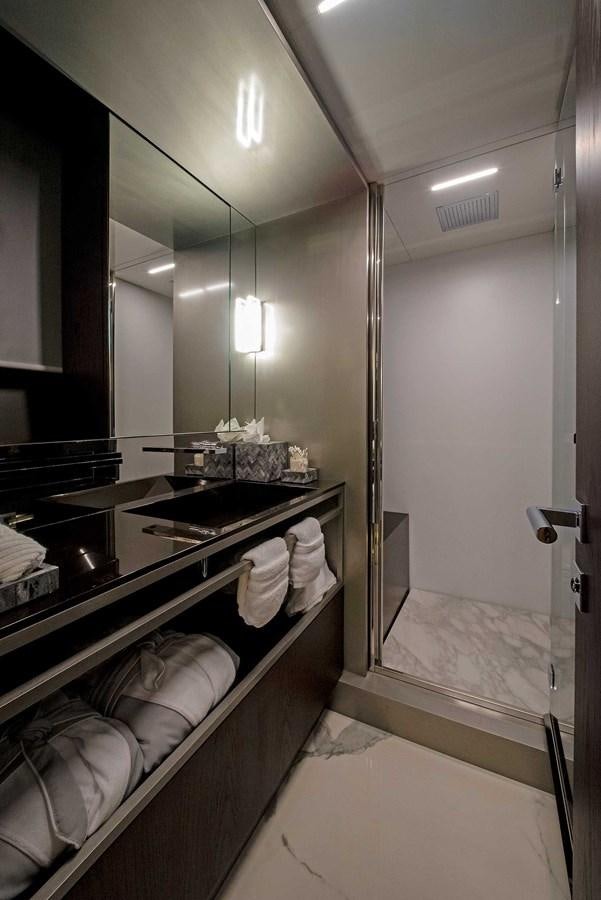 a bathroom with a large mirror aboard LA MARTINA Yacht for Sale