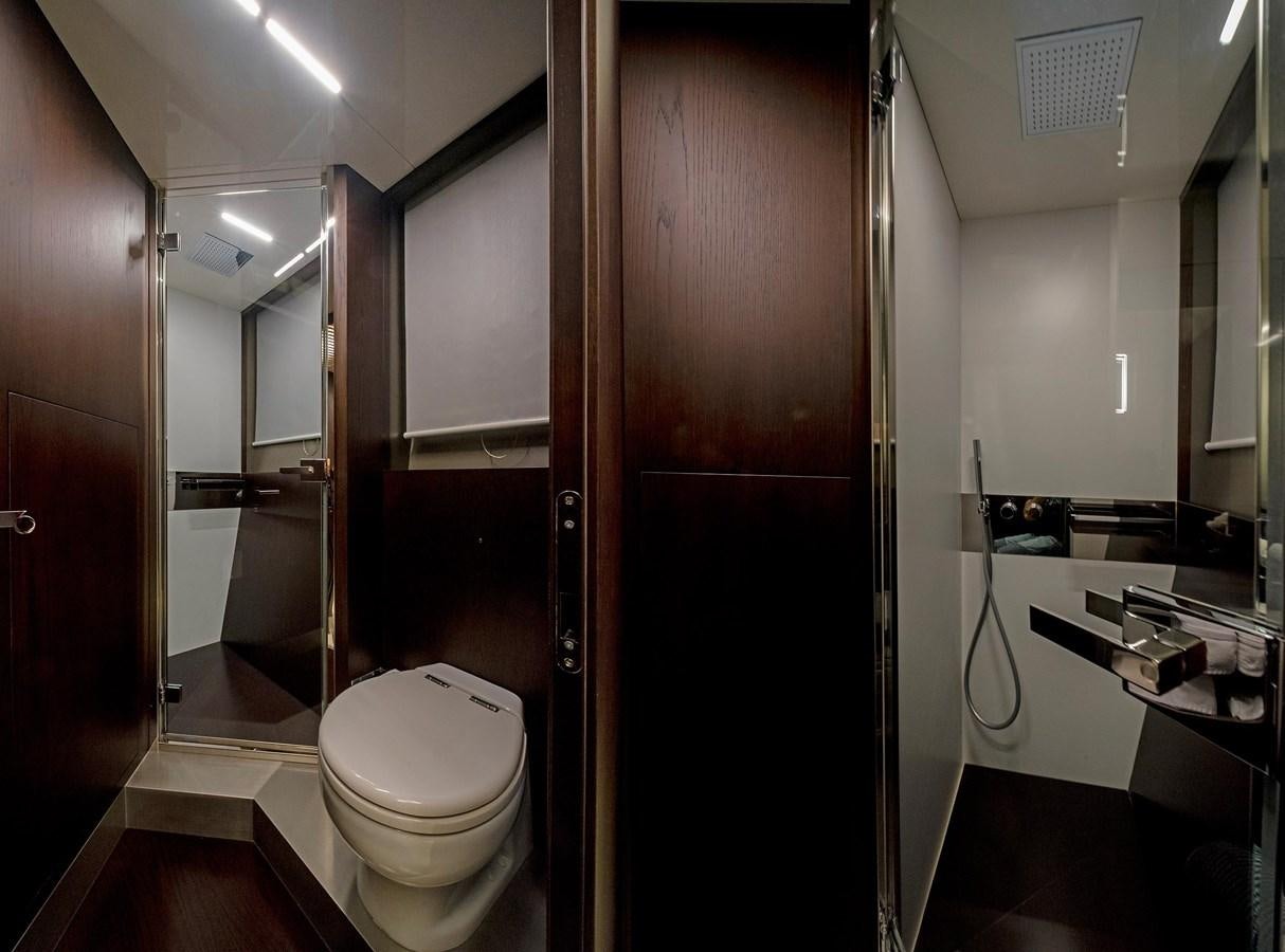 a bathroom with a toilet and a sink aboard LA MARTINA Yacht for Sale