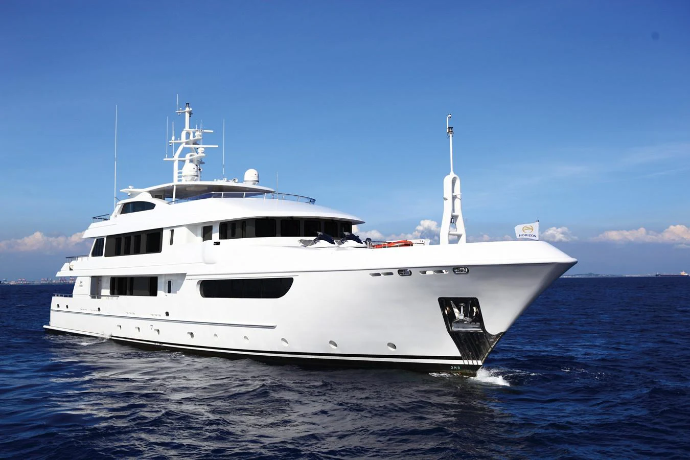 a white boat in the water aboard EP150 Yacht for Sale