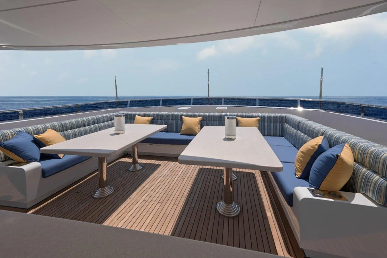 a room with a table and a couch aboard EP150 Yacht for Sale