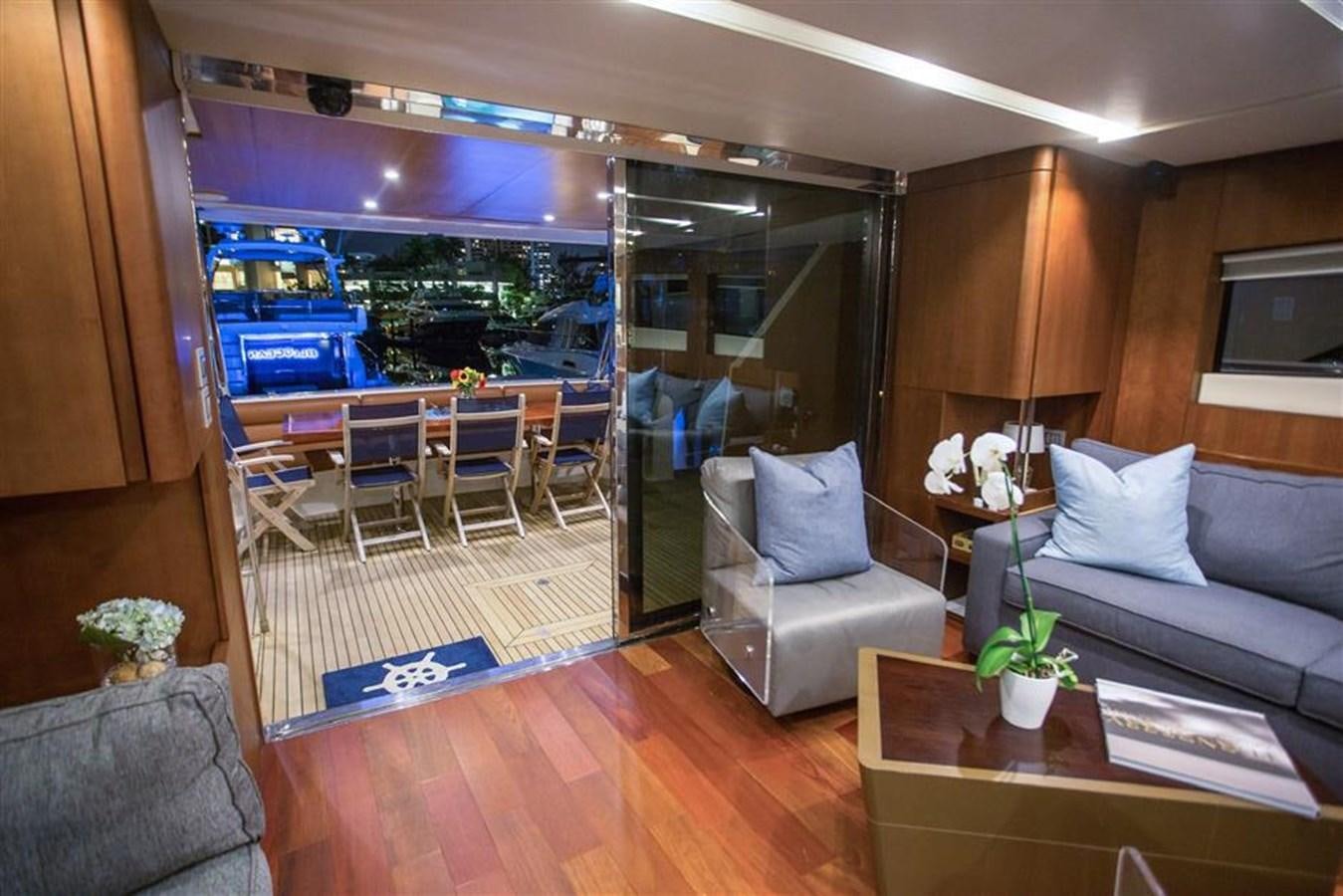 a living room with a view of the water aboard BLUOCEAN Yacht for Sale