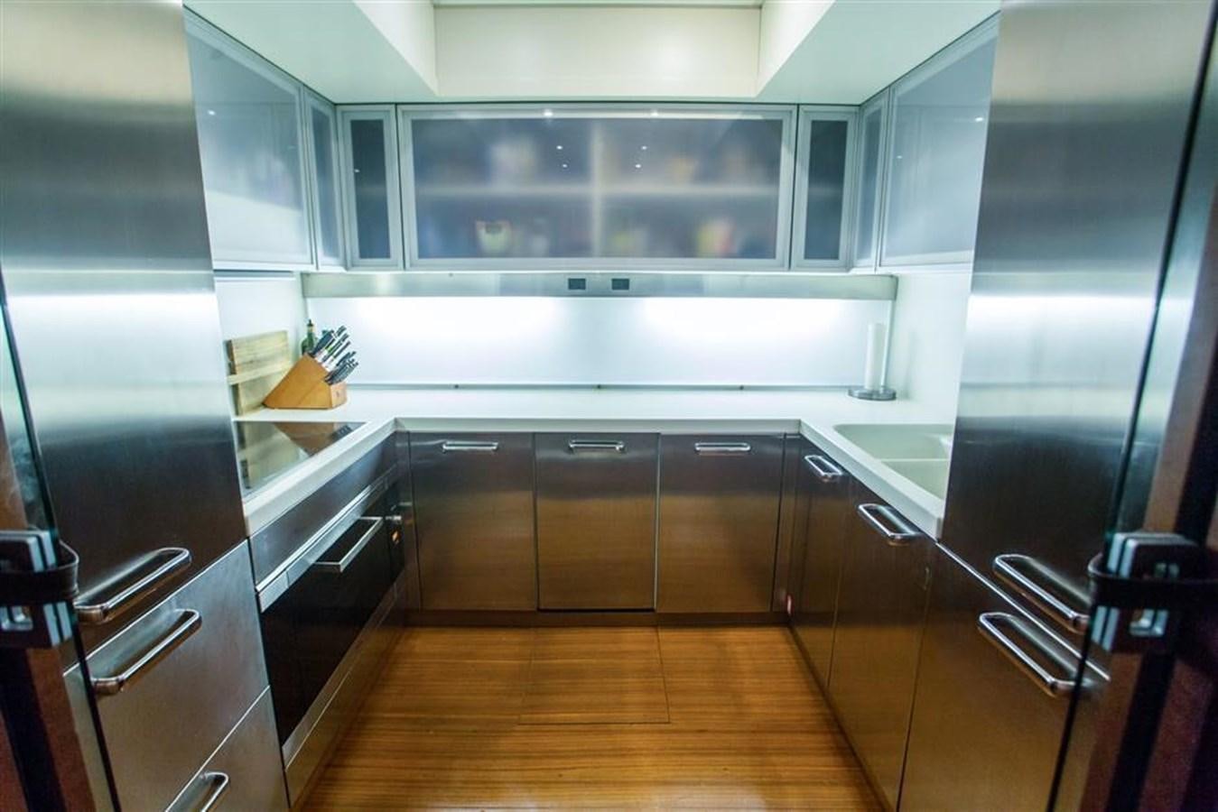 a kitchen with a large glass wall aboard BLUOCEAN Yacht for Sale