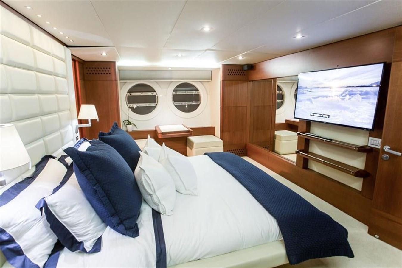 a room with a bed and a television aboard BLUOCEAN Yacht for Sale