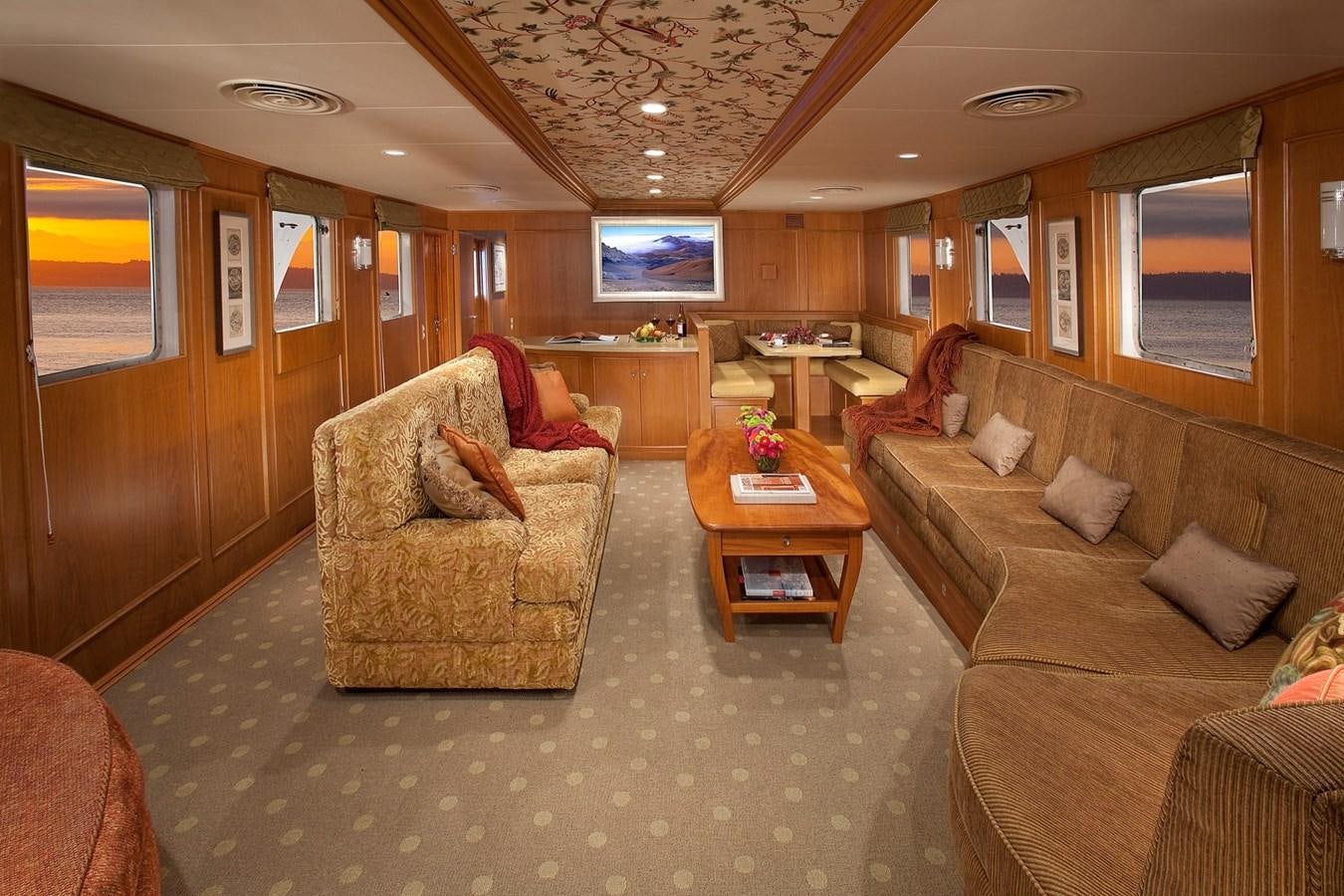 a living room with a couch and a tv aboard MONTEGO Yacht for Sale