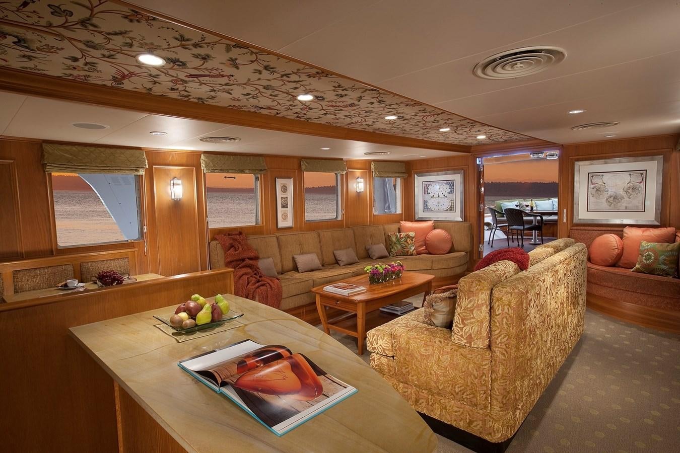 a living room with a couch and a coffee table aboard MONTEGO Yacht for Sale