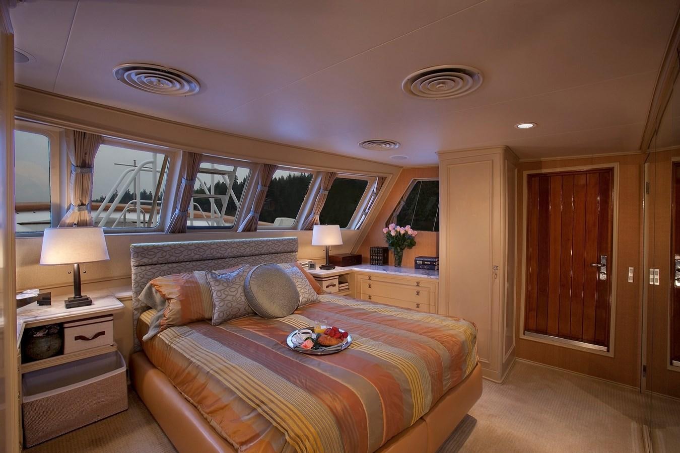 a bedroom with a bed and a desk aboard MONTEGO Yacht for Sale
