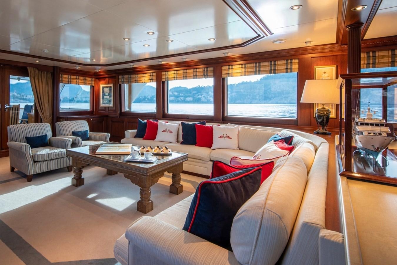 a living room with a large window aboard MONACO Yacht for Sale