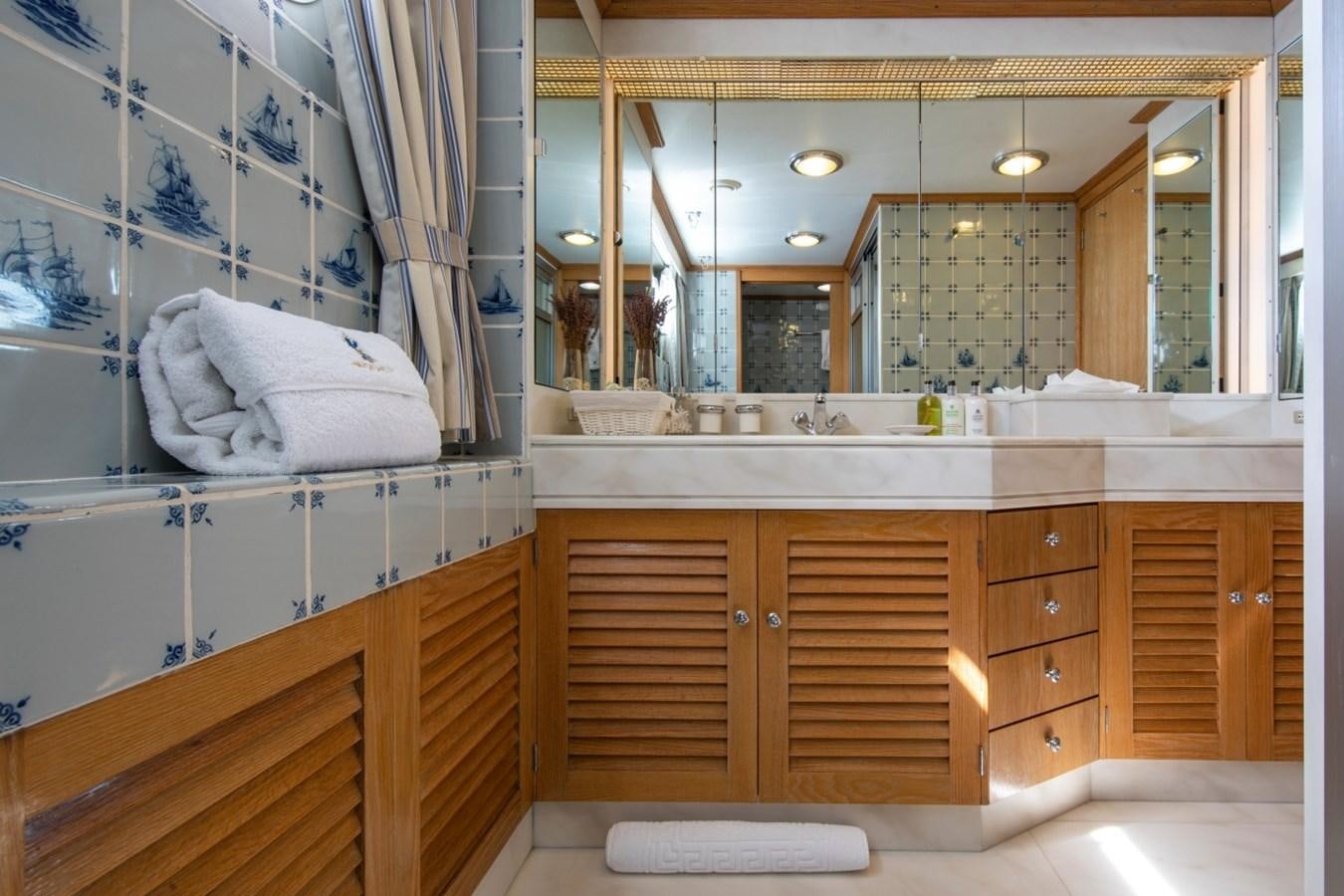 a bathroom with a large mirror aboard MONACO Yacht for Sale