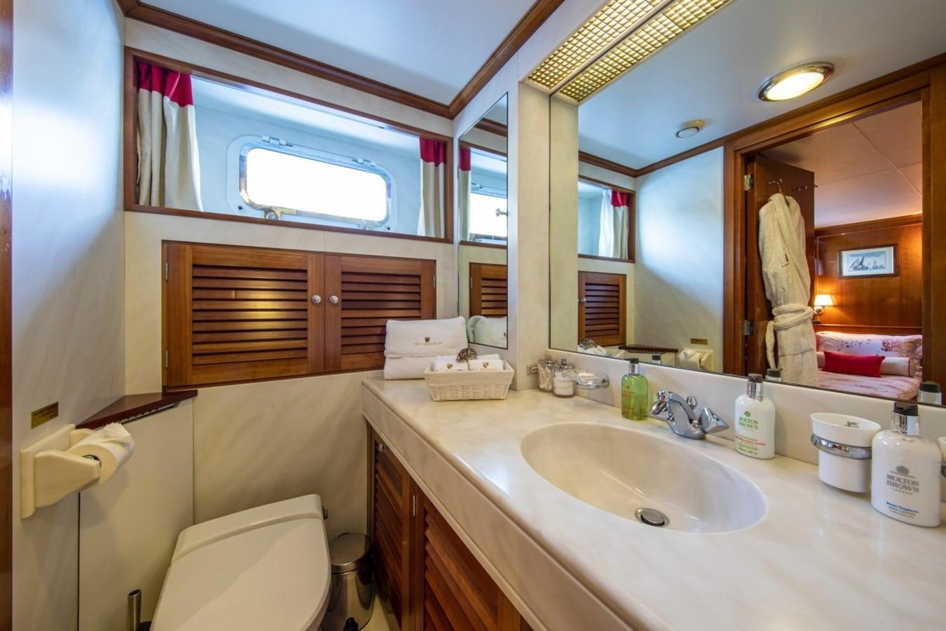 a bathroom with a sink and a mirror aboard MONACO Yacht for Sale