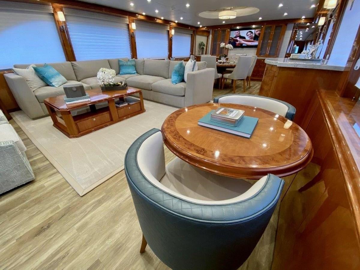 a living room with a couch and a table aboard BRANDI WINE Yacht for Sale