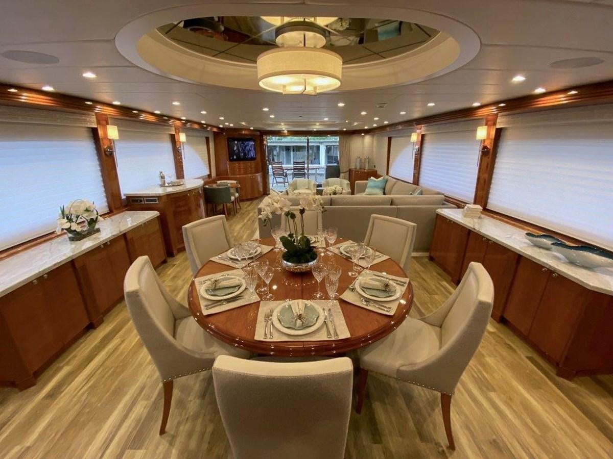 a dining room with a table and chairs aboard BRANDI WINE Yacht for Sale