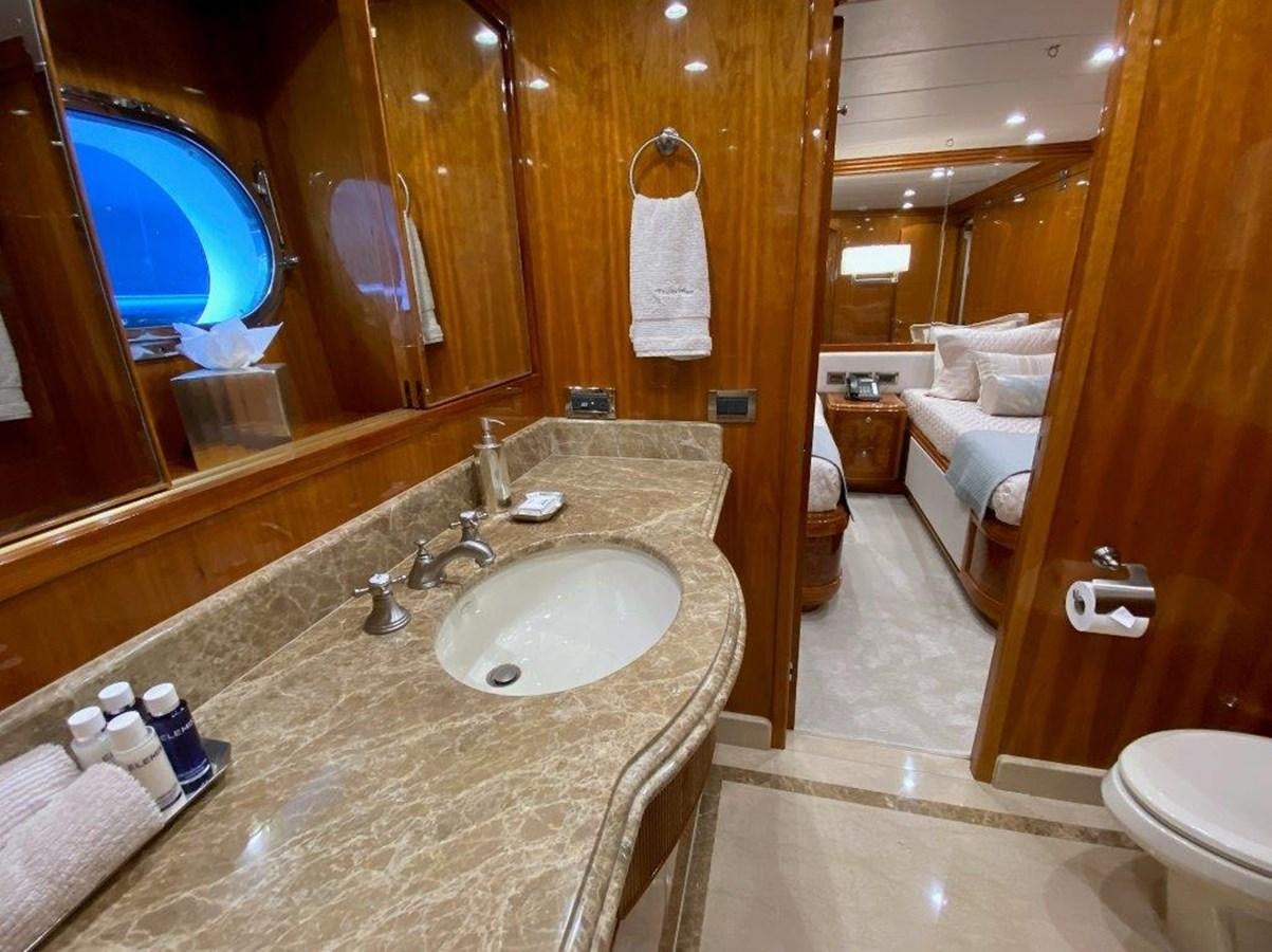 a bathroom with a large marble countertop aboard BRANDI WINE Yacht for Sale