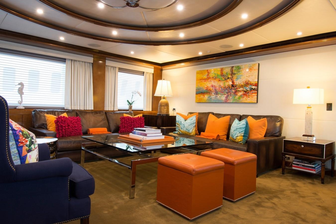 a living room with a couch and a coffee table aboard HORIZONS II Yacht for Sale