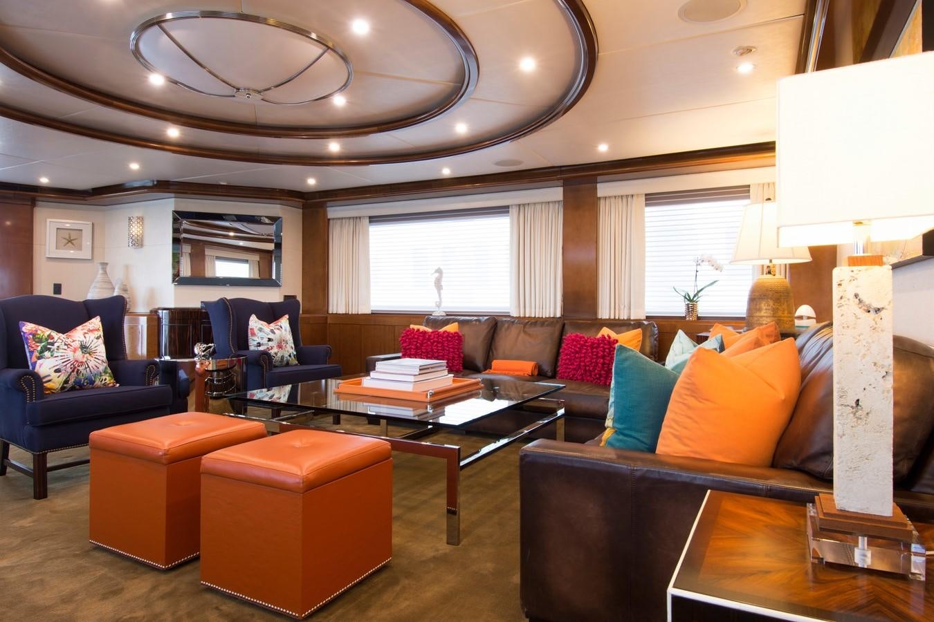 a living room with a couch and a coffee table aboard HORIZONS II Yacht for Sale