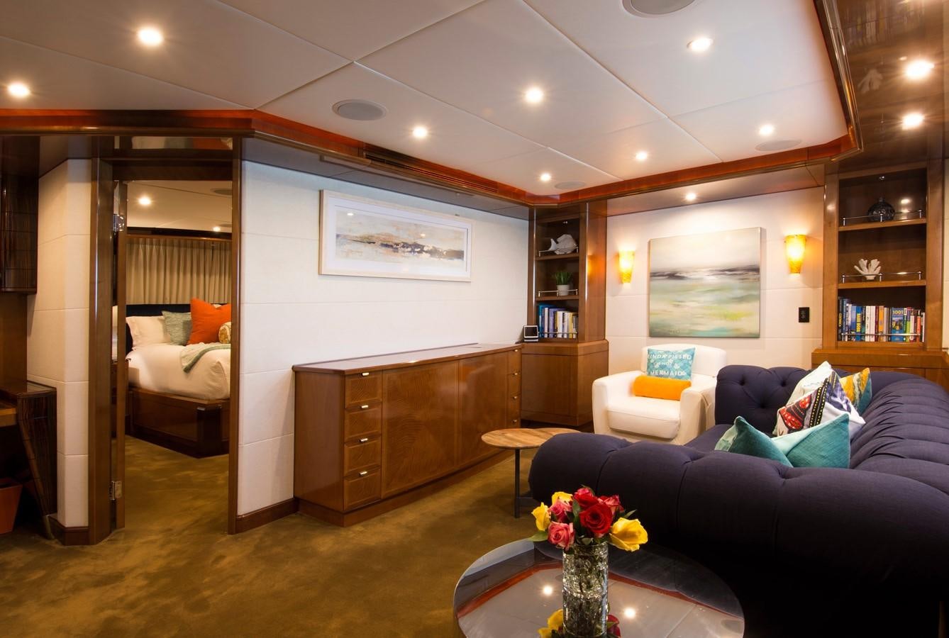 a living room with a couch and a coffee table aboard HORIZONS II Yacht for Sale