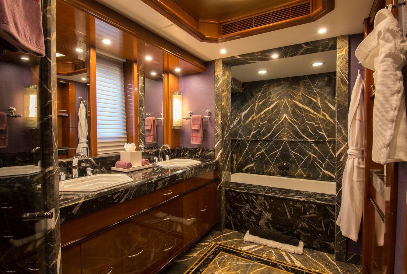 a bathroom with a large mirror aboard HORIZONS II Yacht for Sale