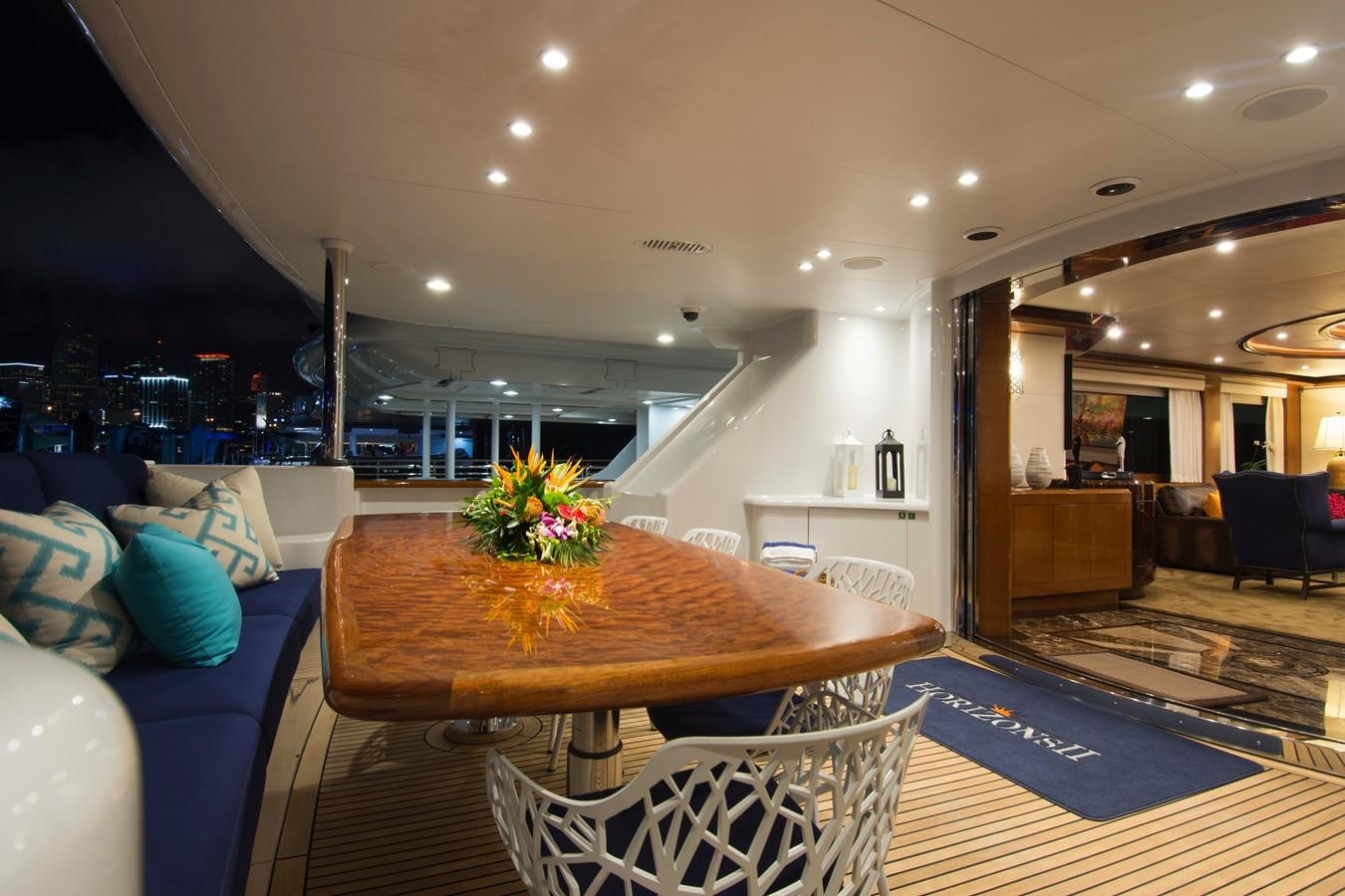 a large dining table in a living room aboard HORIZONS II Yacht for Sale