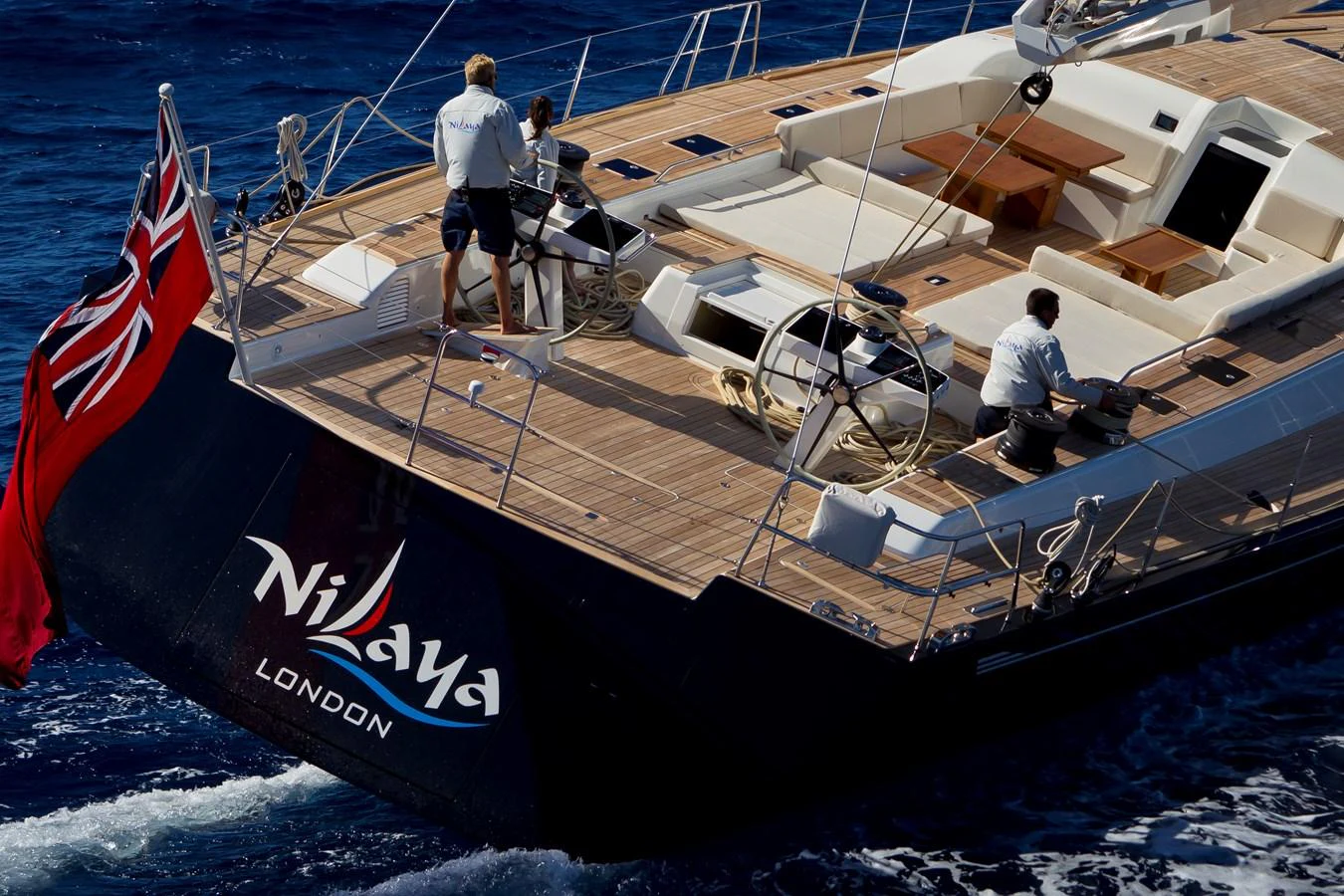 a group of people on a boat aboard NILAYA Yacht for Sale