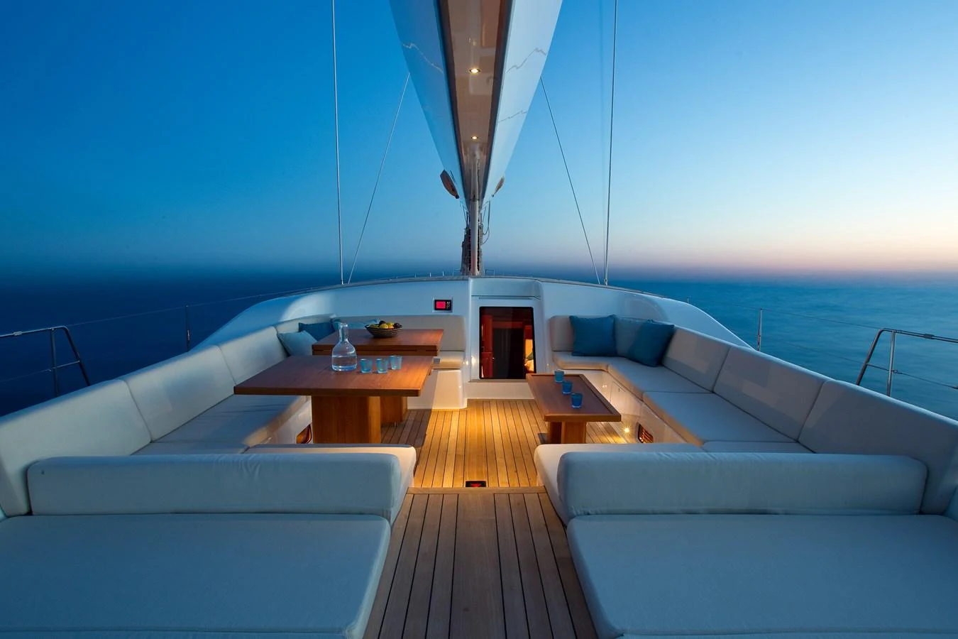 a room with a couch and a table and a window aboard NILAYA Yacht for Sale