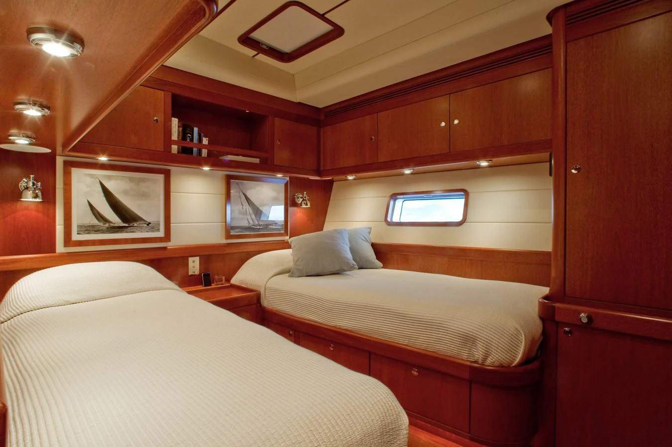 a room with two beds aboard NILAYA Yacht for Sale