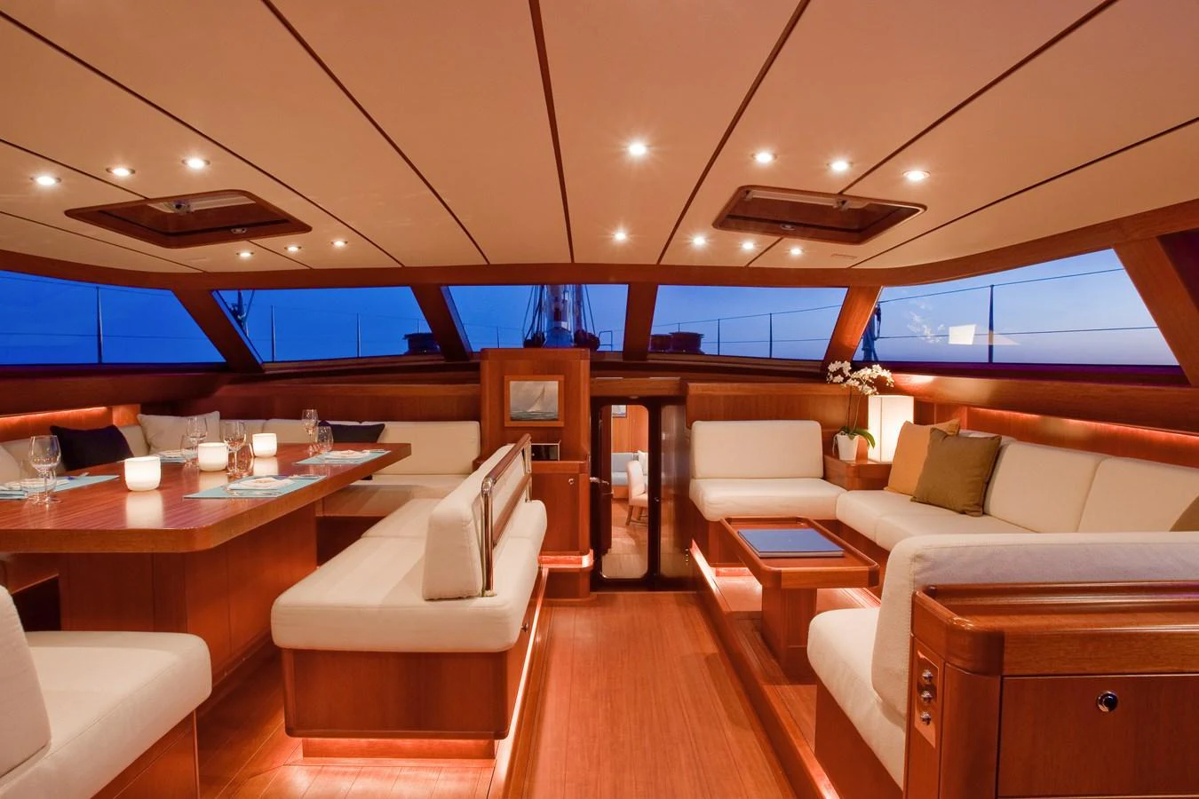 a room with a table chairs and a couch aboard NILAYA Yacht for Sale