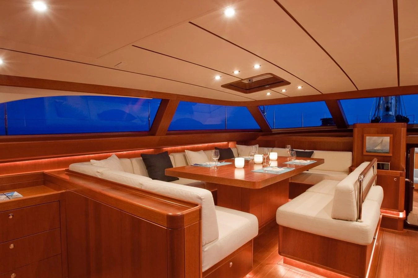 a room with a table and chairs aboard NILAYA Yacht for Sale
