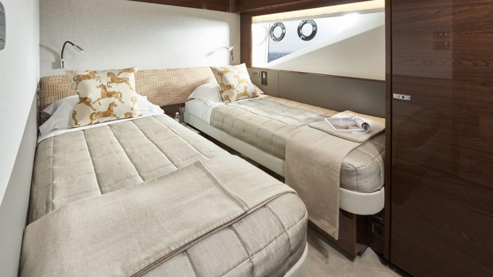 a couple of beds in a room aboard PRINCESS X95/03 Yacht for Sale