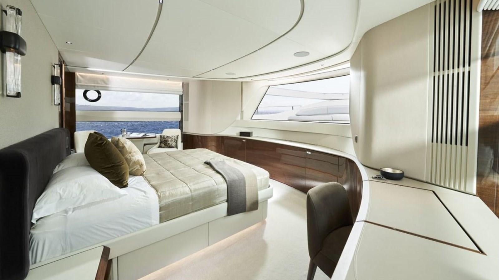 a room with a bed and a window aboard PRINCESS X95/03 Yacht for Sale