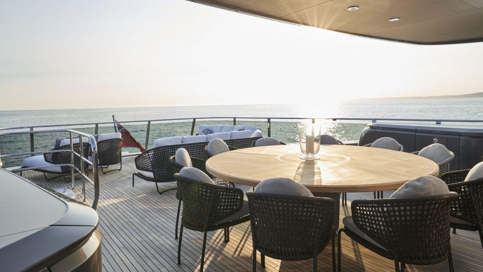 a table with chairs on it aboard PRINCESS X95/03 Yacht for Sale