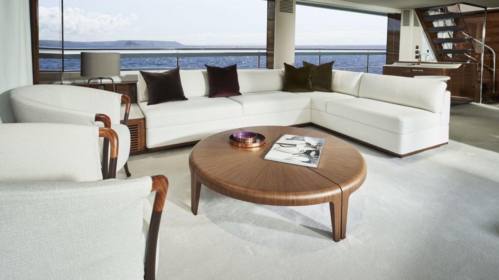 a living room with a couch and a table aboard PRINCESS X95/03 Yacht for Sale